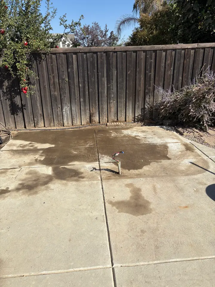 The same backyard patio after the hot tub was removed and hauled away